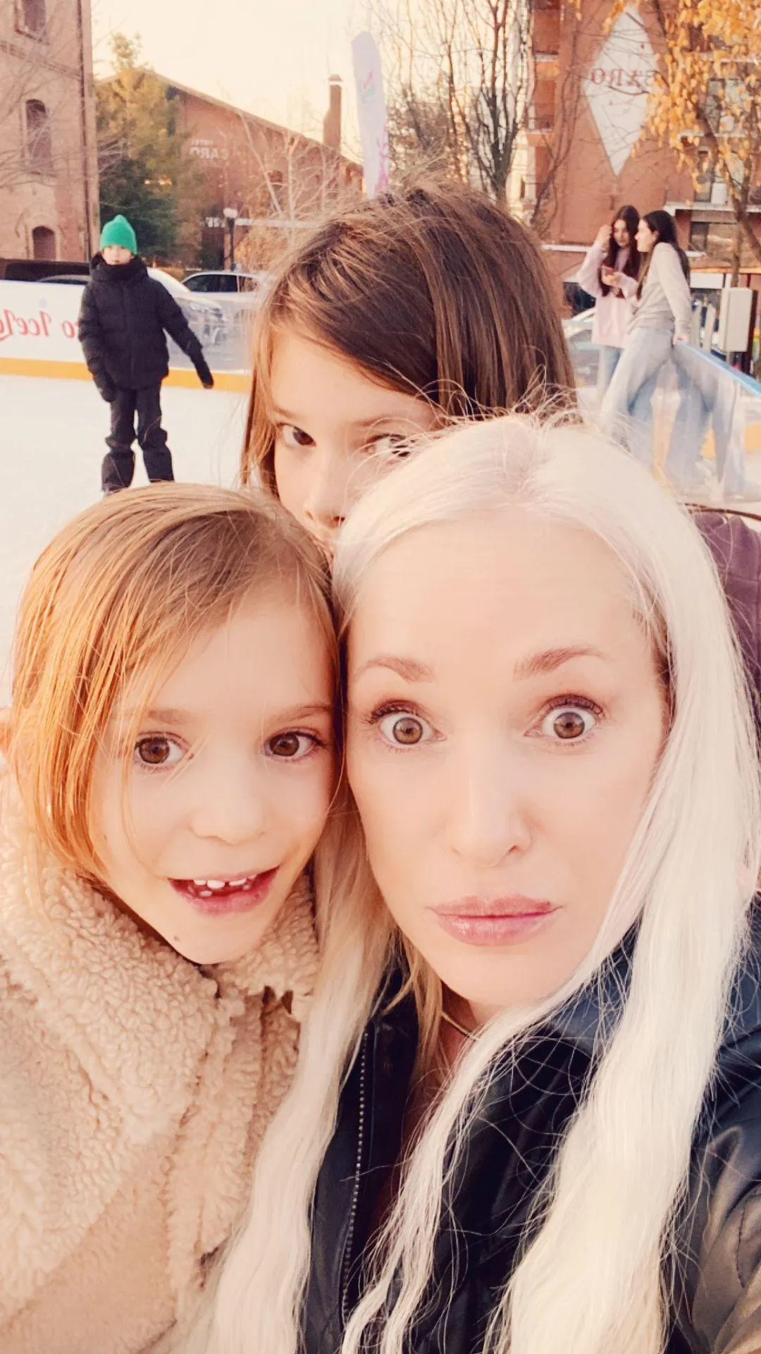Winter at the ice rink with two of her children.
